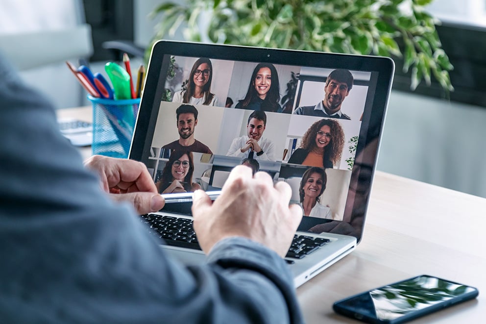 Man on a video call with colleagues