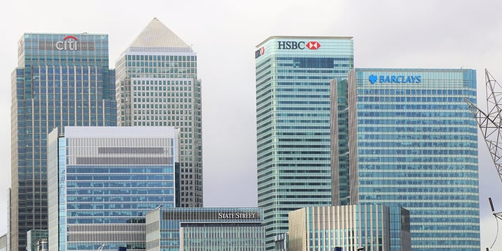 Tall bank buildings, one is a HSBC bank and another is Barclays.