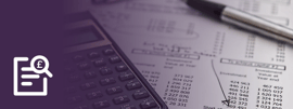 A calculator and pen on a sheet of paper