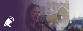 Young woman holding a megaphone