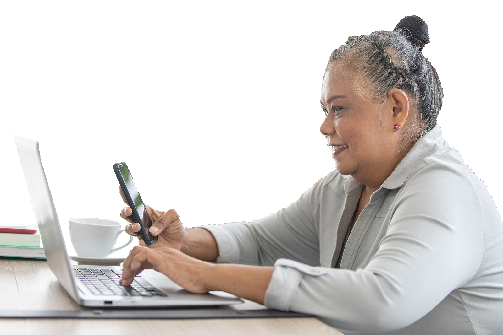 Lady with Hair tied in bun on laptop