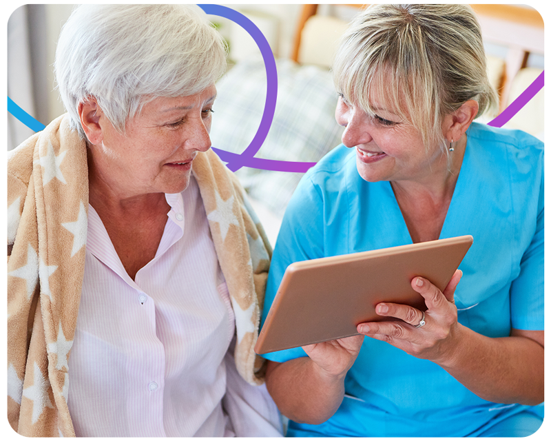 A nurse explaining how to use an ipad to a patient