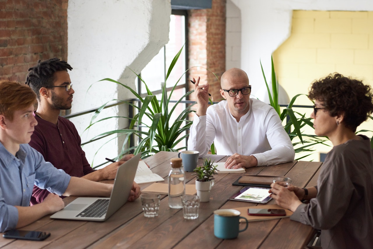 Four people in a meeting