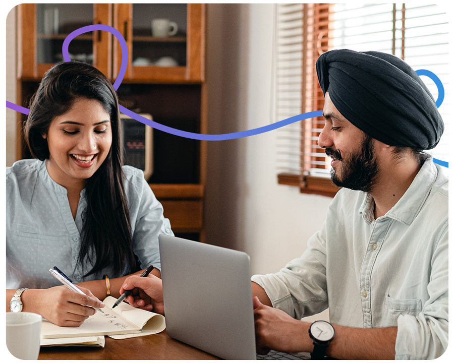 man and woman looking at their finances